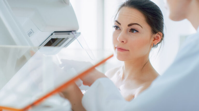 Female Patient Undergoing Mammogram Screening Procedure.